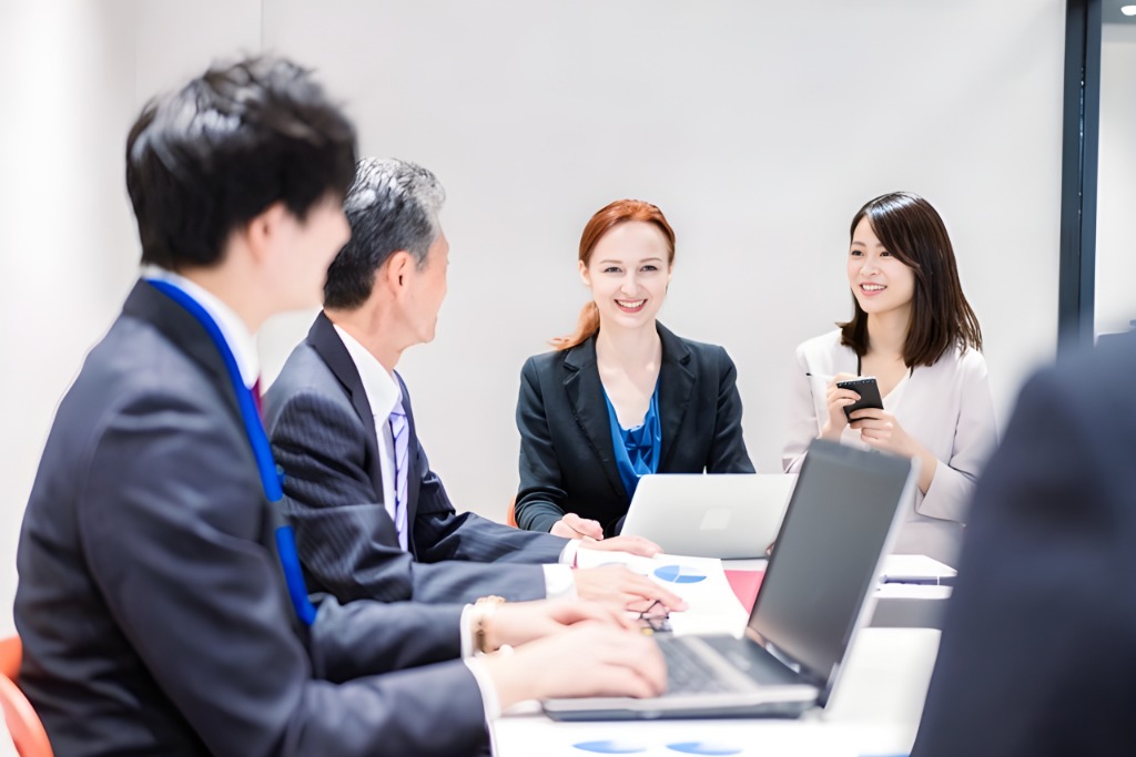 A female interpreter is providing a simultaneous interpreting at the meeting.